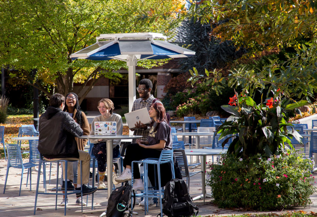 Phelps Scholars Program students enjoying some fellowship in the new patio space between Phelps Dining Hall and Lubbers Hall.